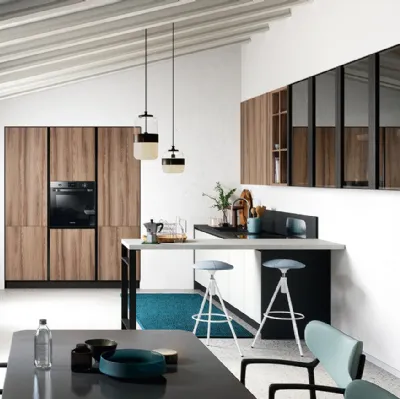 Cucina Moderna con penisola Colibrì Presa in finitura bianco luce e noce nordico di Forma la cucina